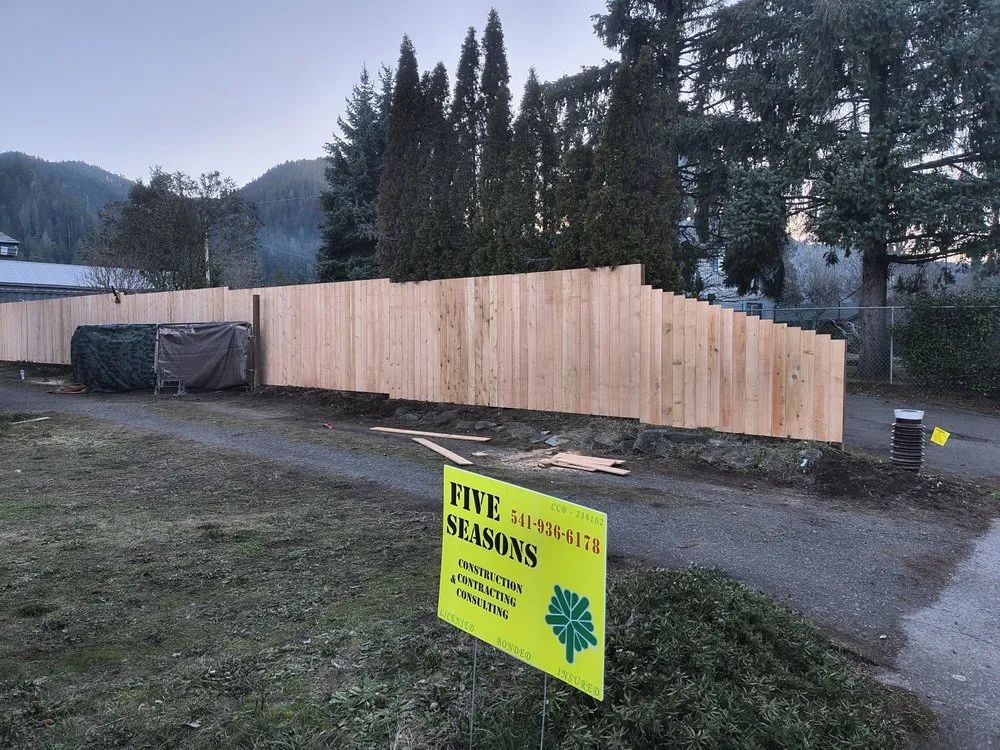 Affordable wood fence service for homes in Springfield, OR by Five Seasons